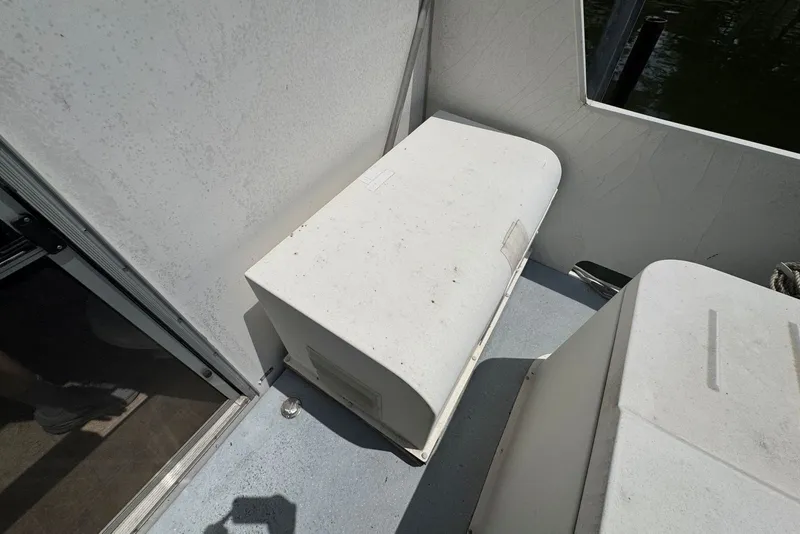 Slide: The Image of 2011 Catamaran Cruisers Lil Hobo 31 interior with white seating and flooring. - 37
