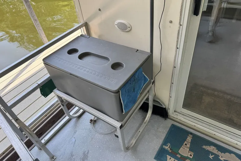 Slide: The Image of Outdoor deck of 2011 Catamaran Cruisers Lil Hobo 31 with cooler and mat. - 12