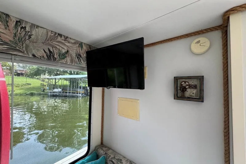 Slide: The Image of Interior of 2011 Catamaran Cruisers Lil Hobo 31 with TV and lake view. - 24