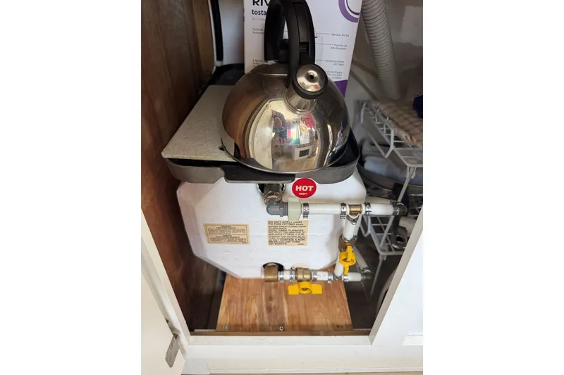 Slide: The Image of Kettle on a water heater inside a 2011 Catamaran Cruisers Lil Hobo 31 boat. - 30