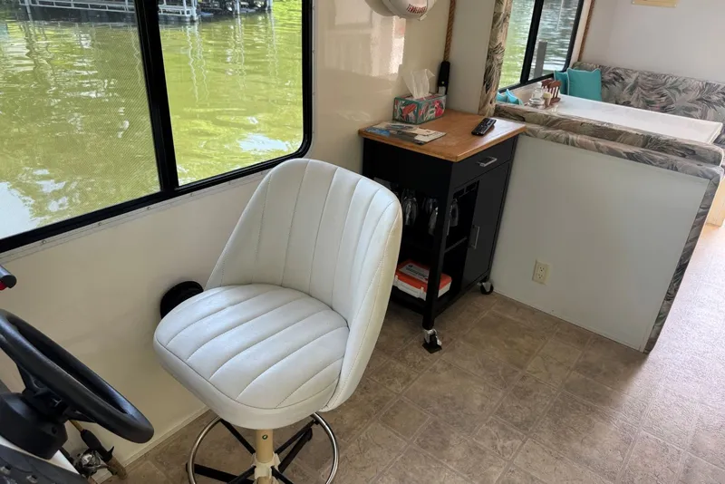 Slide: The Image of Interior of 2011 Catamaran Cruisers Lil Hobo 31 with seating and dining area. - 15