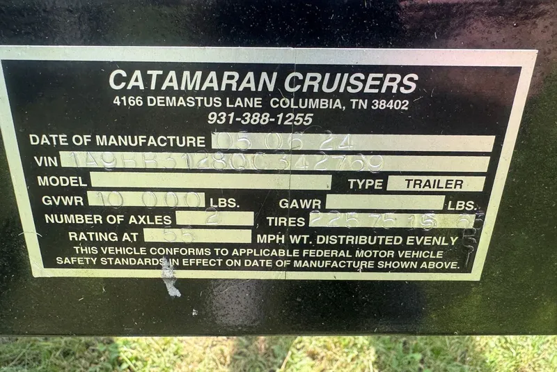 Slide: The Image of Label on Catamaran Cruisers Lil Hobo 31 trailer, manufactured in 2011, showing specifications. - 48