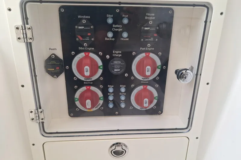Slide: The Image of Control panel of a 2020 Century 3200 Center Console boat with switches and dials. - 14