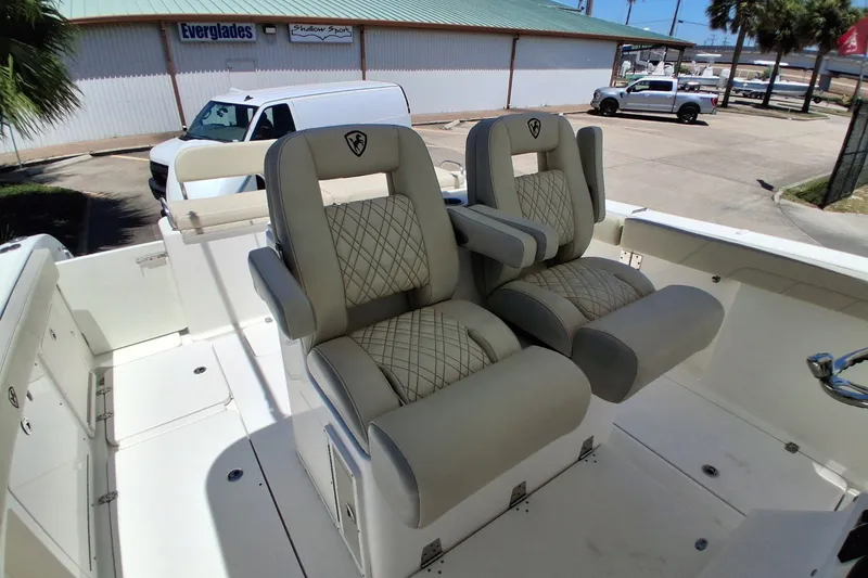Slide: The Image of Luxury seating on a 2020 Century 3200 Center Console boat, featuring diamond-stitched upholstery. - 25