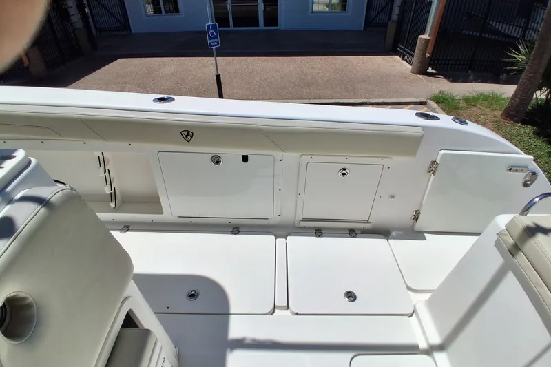 Slide: The Image of 2020 Century 3200 Center Console boat interior with storage compartments and seating. - 28