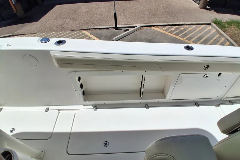 Slide: The Image of 2020 Century 3200 Center Console boat interior with storage compartments and seating. - 18