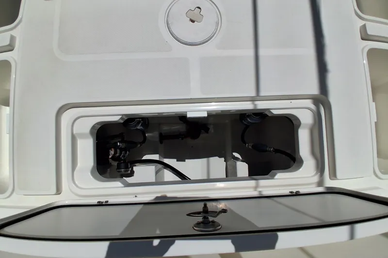Slide: The Image of Open hatch on 2020 Century 3200 Center Console boat, revealing internal components. - 30