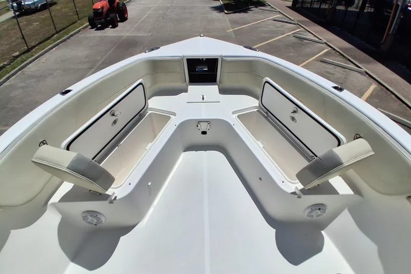 Slide: The Image of 2020 Century 3200 Center Console boat interior with open storage compartments and seating. - 6