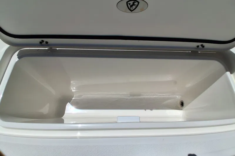 Slide: The Image of Open storage compartment on 2020 Century 3200 Center Console boat. - 31