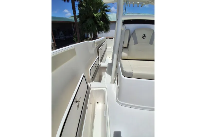 Slide: The Image of 2020 Century 3200 Center Console boat interior with storage compartments and seating. - 22