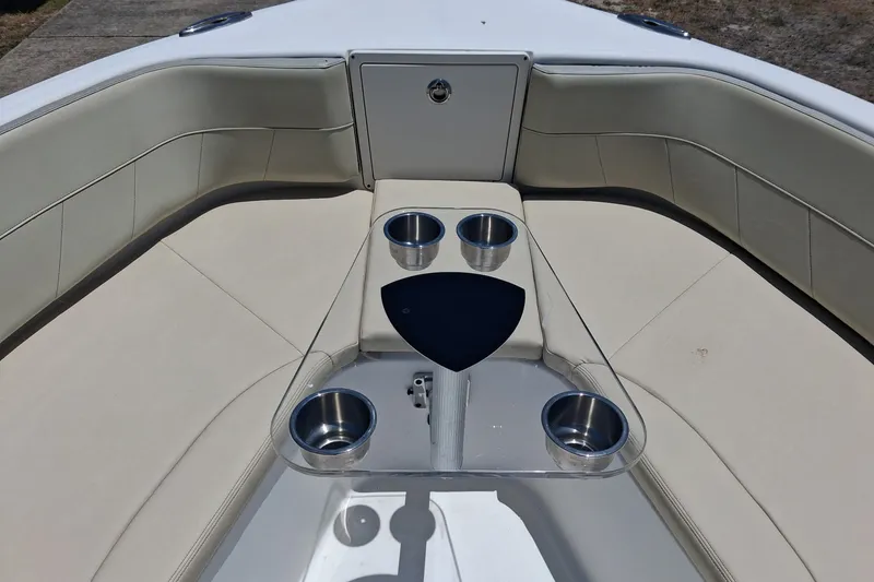Slide: The Image of 2020 Century 3200 Center Console boat interior with cup holders and cushioned seating. - 3