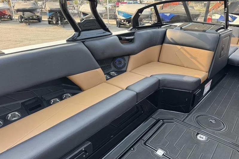 Slide: The Image of Luxurious interior of 2027 Moomba Tykon boat with tan and black seating. - 13