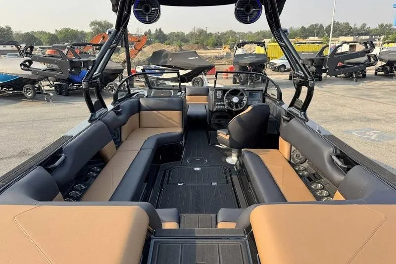 Slide: The Image of Interior of 2027 Moomba Tykon boat with spacious seating and modern dashboard. - 12
