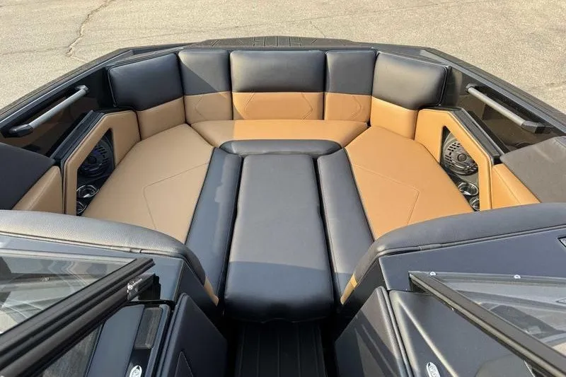 Slide: The Image of Luxurious interior of 2027 Moomba Tykon boat with tan and black seating. - 10