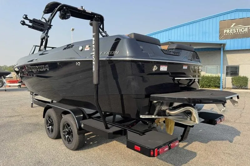 Slide: The Image of 2027 Moomba Tykon boat on trailer at Prestige Water Sports dealership. - 6