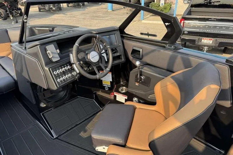 Slide: The Image of Interior of 2027 Moomba Tykon boat, featuring modern steering and control panel. - 16