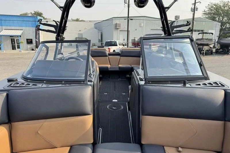 Slide: The Image of 2027 Moomba Tykon boat interior with sleek seating and modern design. - 14