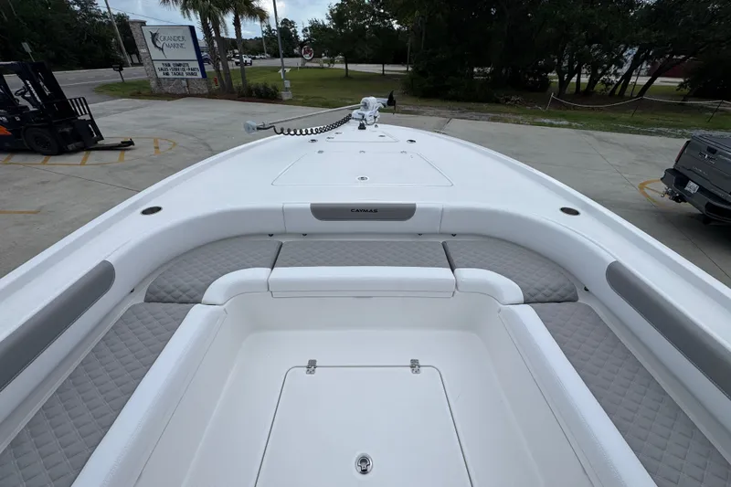 Slide: The Image of 2027 Caymas 281 HB boat interior with cushioned seating and sleek design. - 21