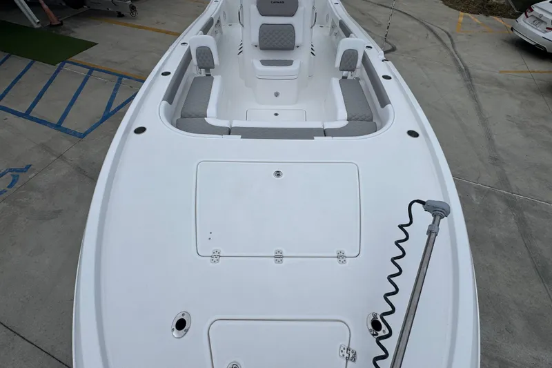 Slide: The Image of 2027 Caymas 281 HB boat deck with seating and storage compartments. - 25