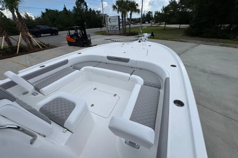 Slide: The Image of 2027 Caymas 281 HB boat interior with cushioned seating and sleek design. - 20