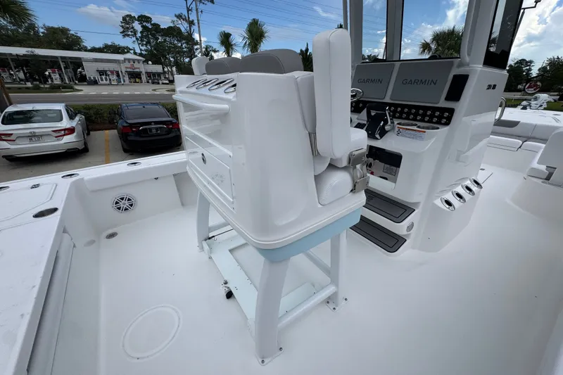 Slide: The Image of 2027 Caymas 281 HB boat interior with Garmin electronics and seating. - 43