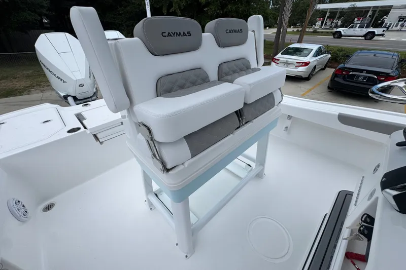 Slide: The Image of 2027 Caymas 281 HB boat with dual cushioned seats and Mercury engine. - 34