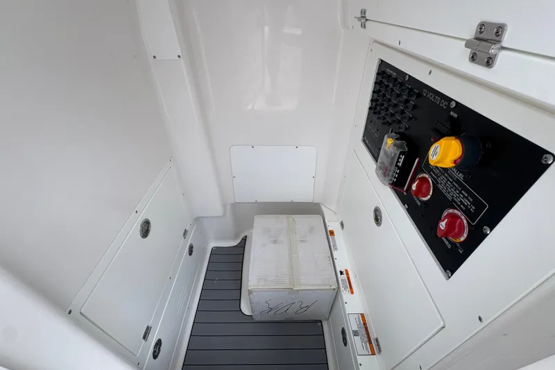 Slide: The Image of Interior view of 2027 Caymas 281 HB boat with control panel and storage area. - 30