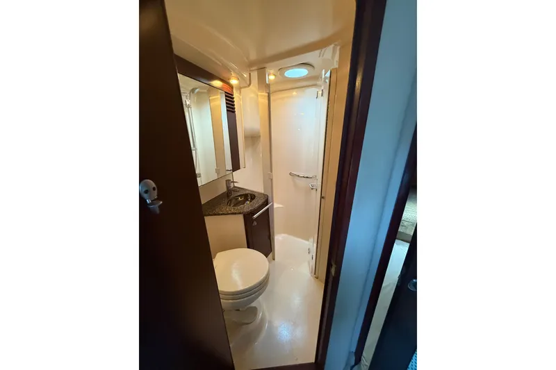 Slide: The Image of Bathroom interior of 2008 Sea Ray 44 Sedan Bridge yacht, featuring shower and vanity. - 37