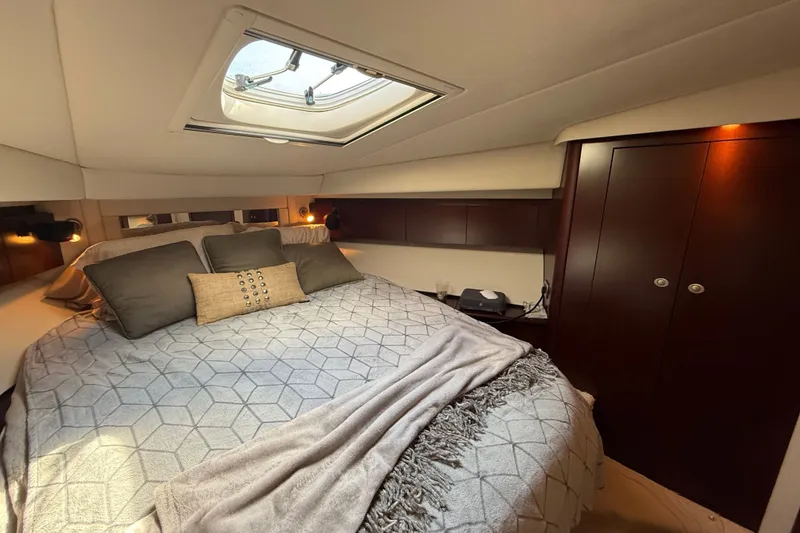 Slide: The Image of Luxurious bedroom interior of 2008 Sea Ray 44 Sedan Bridge yacht with skylight. - 39