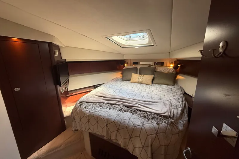 Slide: The Image of Luxurious 2008 Sea Ray 44 Sedan Bridge cabin with cozy bed and elegant decor. - 38