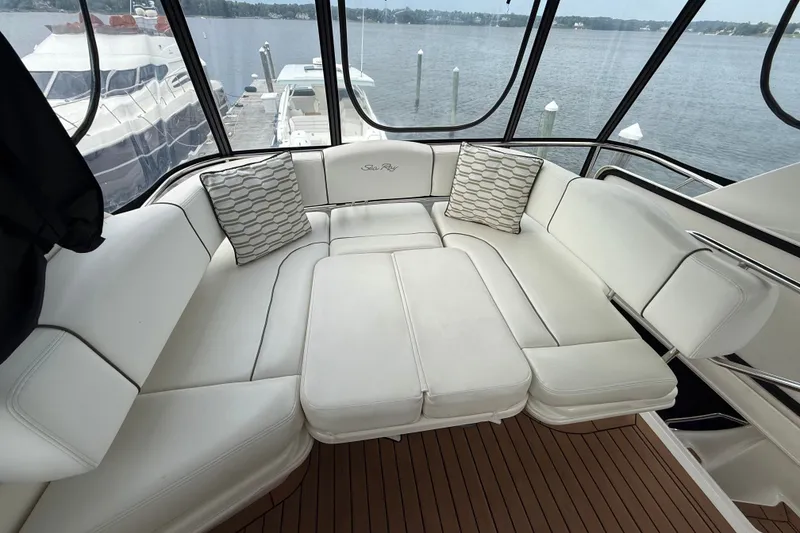 Slide: The Image of Luxurious seating area on 2008 Sea Ray 44 Sedan Bridge yacht with scenic water view. - 19
