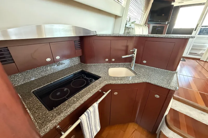 Slide: The Image of Luxurious 2008 Sea Ray 44 Sedan Bridge yacht kitchen with modern amenities and sleek design. - 32