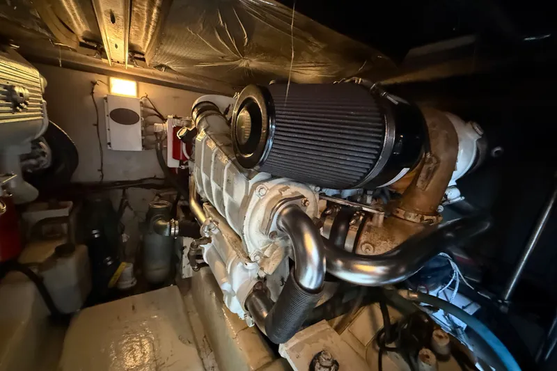 Slide: The Image of Engine room of a 2008 Sea Ray 44 Sedan Bridge, showcasing mechanical components. - 53