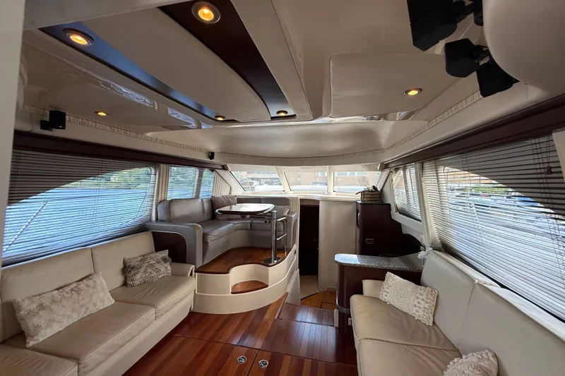 Slide: The Image of Luxurious interior of 2008 Sea Ray 44 Sedan Bridge yacht with elegant seating and wood flooring. - 24