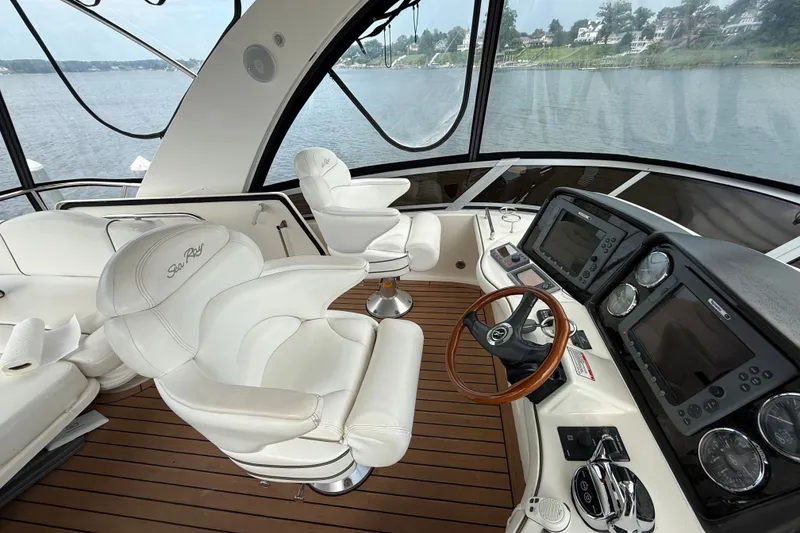 Slide: The Image of Luxurious 2008 Sea Ray 44 Sedan Bridge yacht interior with modern helm and plush seating. - 15