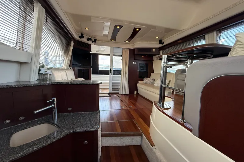 Slide: The Image of Luxurious interior of 2008 Sea Ray 44 Sedan Bridge yacht with modern furnishings. - 23