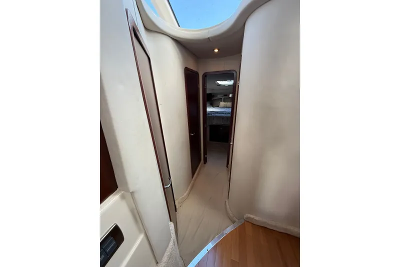 Slide: The Image of Interior hallway of 2008 Sea Ray 44 Sedan Bridge yacht, featuring elegant wood finishes. - 35