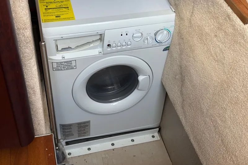 Slide: The Image of Compact washing machine in a 2008 Sea Ray 44 Sedan Bridge yacht interior. - 36