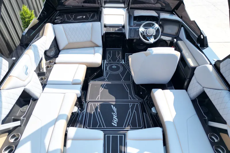 Slide: The Image of Luxurious interior of 2027 Tige Z1 boat with modern seating and sleek design. - 10