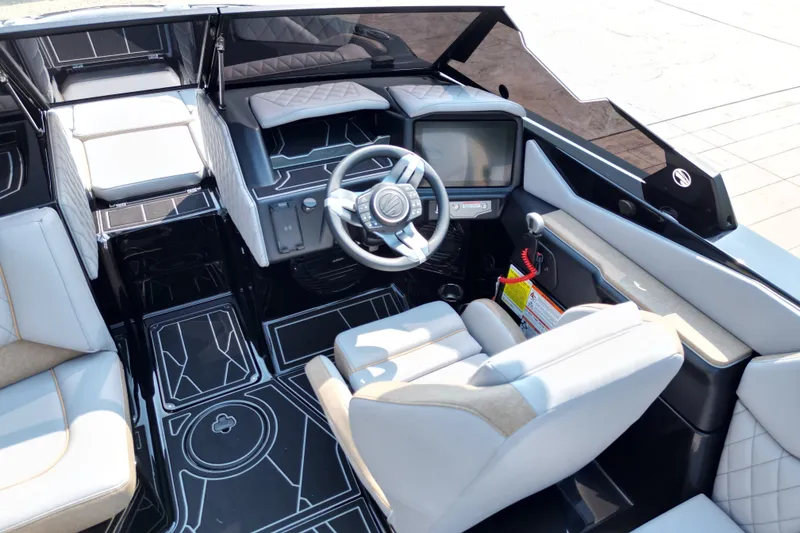 Slide: The Image of 2027 Tige Z1 boat interior with modern dashboard and luxurious seating. - 8