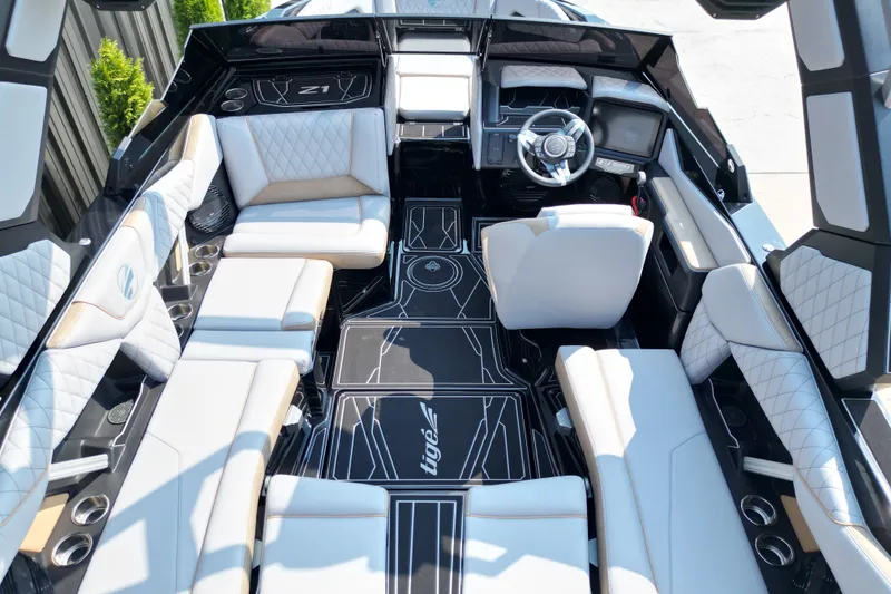 Slide: The Image of Luxurious interior of 2027 Tige Z1 boat with modern seating and sleek design. - 11