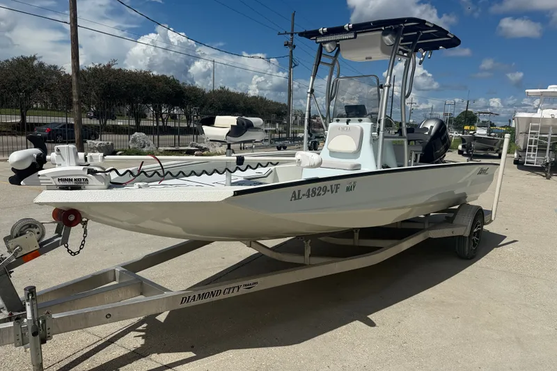 Slide: The Image of 2021 Excel 203 Bay Pro boat on trailer, equipped with Minn Kota trolling motor. - 3