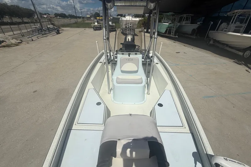 Slide: The Image of 2021 Excel 203 Bay Pro boat on display at a dealership. - 10