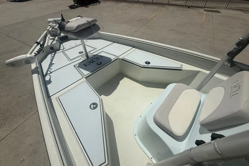 Slide: The Image of 2021 Excel 203 Bay Pro boat deck with seating and trolling motor. - 9