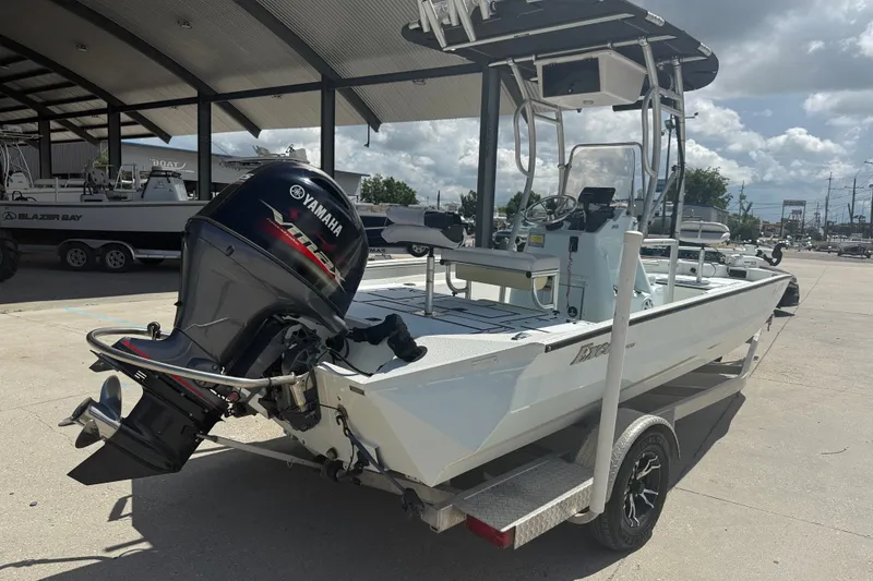 Slide: The Image of 2021 Excel 203 Bay Pro boat with Yamaha outboard motor on trailer. - 6