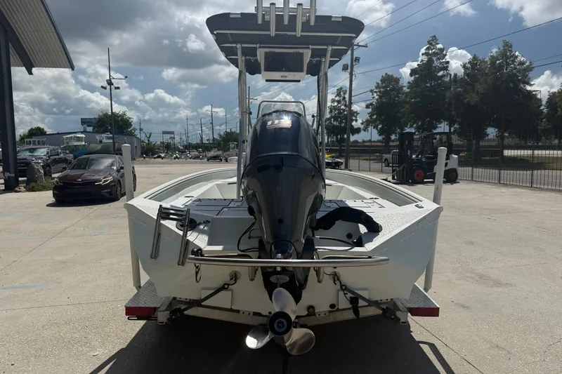 Slide: The Image of 2021 Excel 203 Bay Pro boat on trailer, rear view, parked outdoors. - 5