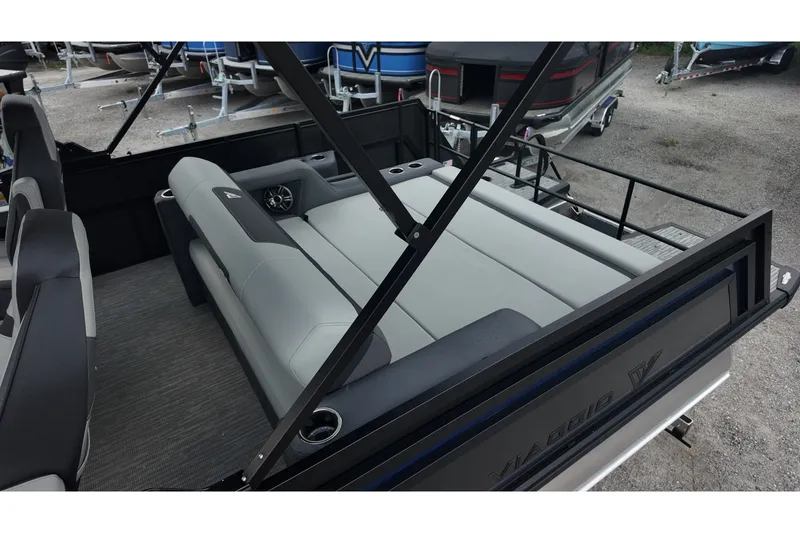 Slide: The Image of Interior of 2027 Viaggio X22S boat with gray seating and cup holders. - 9