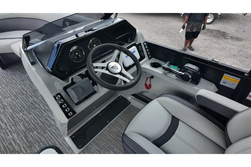 Slide: The Image of Cockpit of 2027 Viaggio X22S boat with modern steering and controls. - 12