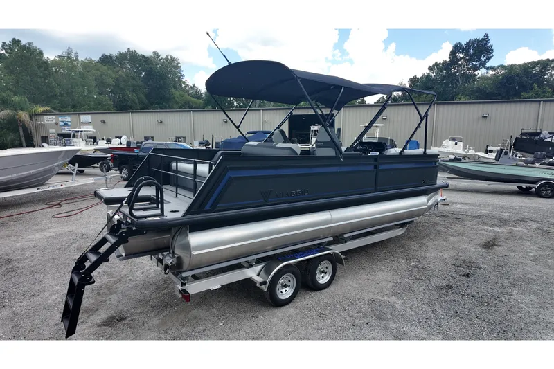 The Image of 2027 Viaggio X22S pontoon boat on trailer, parked outdoors with canopy. - 0