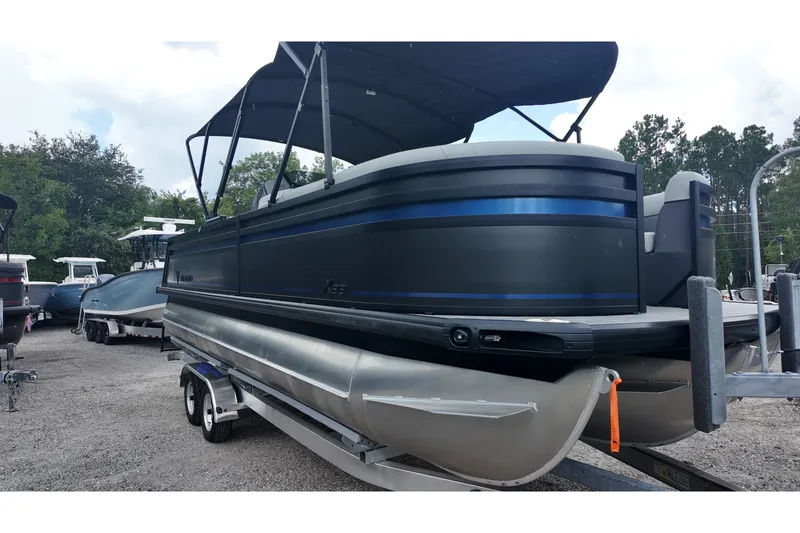 Slide: The Image of 2027 Viaggio X22S pontoon boat with canopy on trailer, parked outdoors. - 16